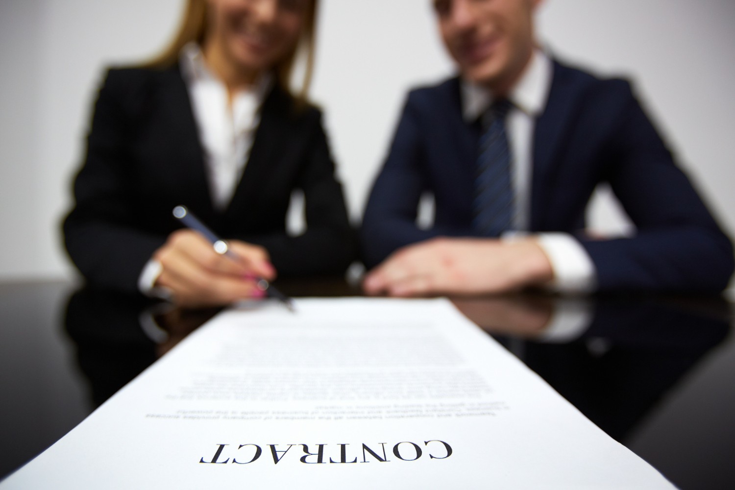 Businesswoman signing a new contract