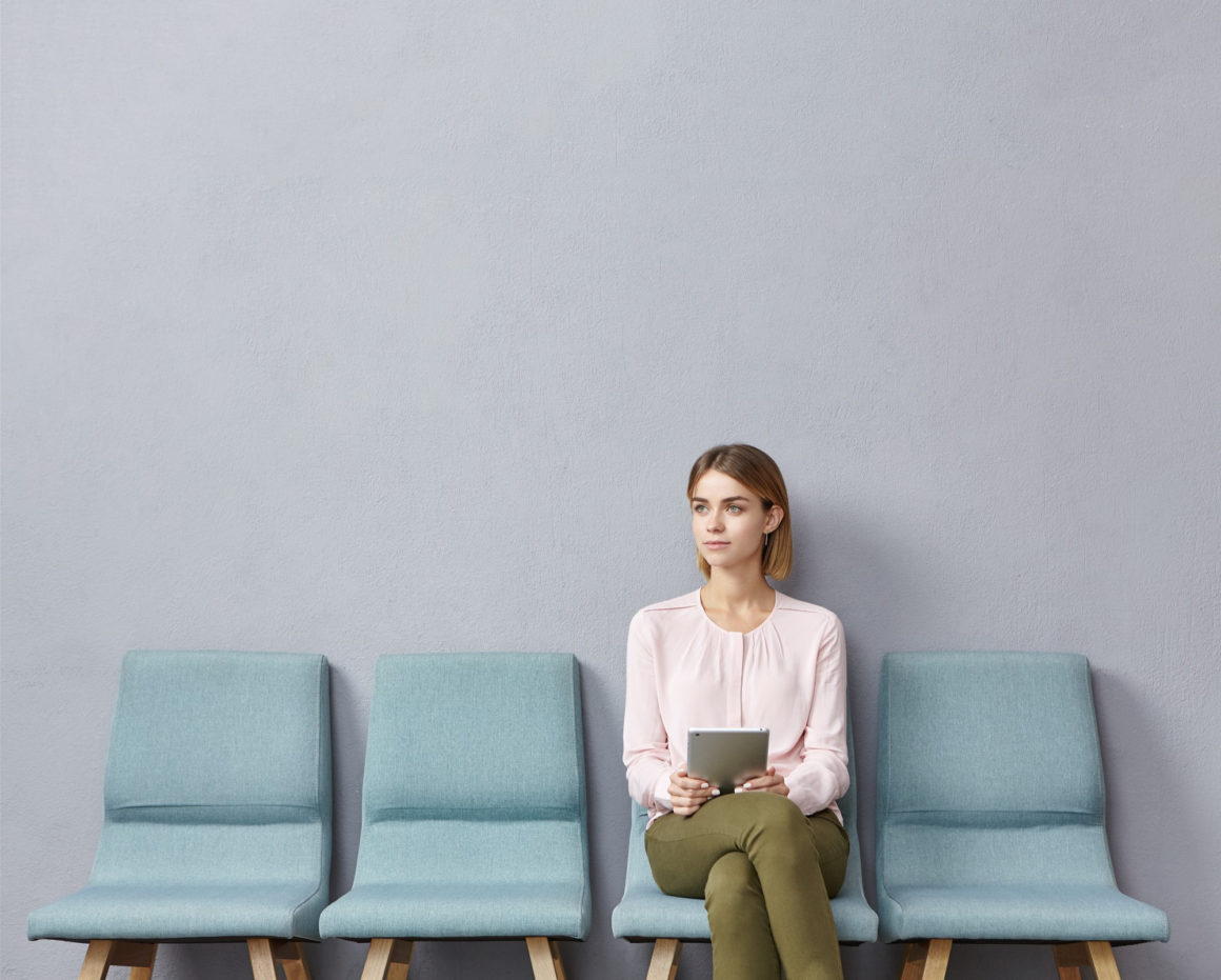 oung woman sitting in waiting room