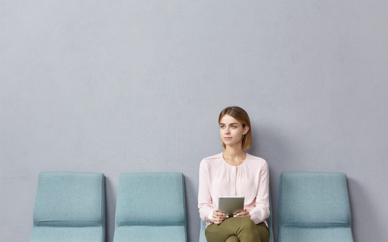 oung woman sitting in waiting room