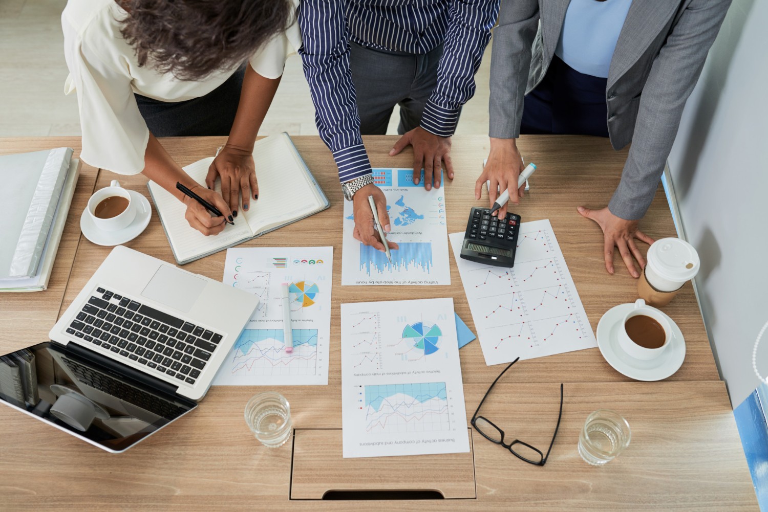 A team of people working with the documents