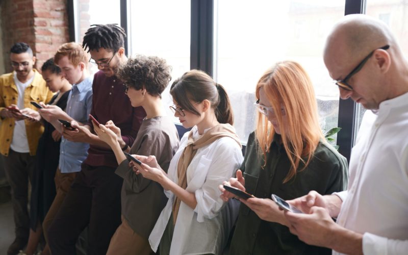 Young people chatting on smartphones