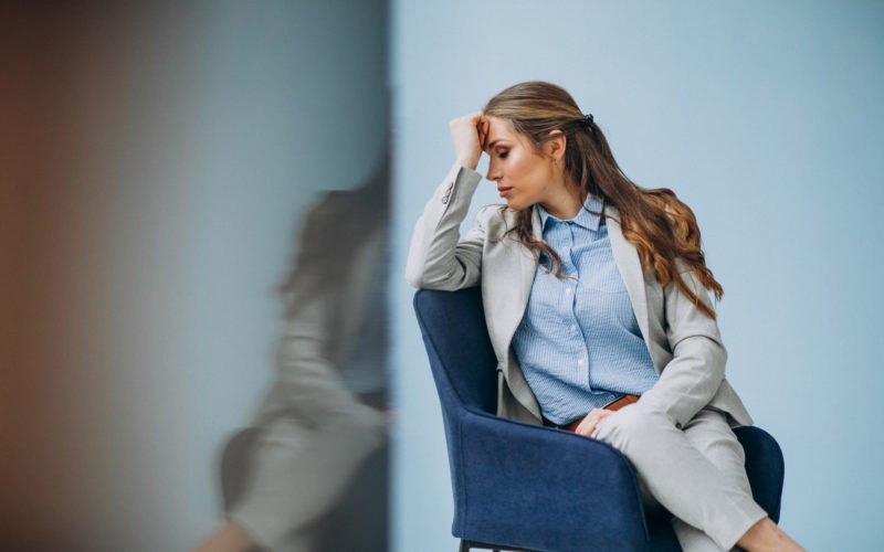 Businesswoman sitting in chair at an office