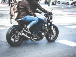 Two Person Riding Gray Cafe Racer