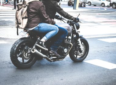 Two Person Riding Gray Cafe Racer