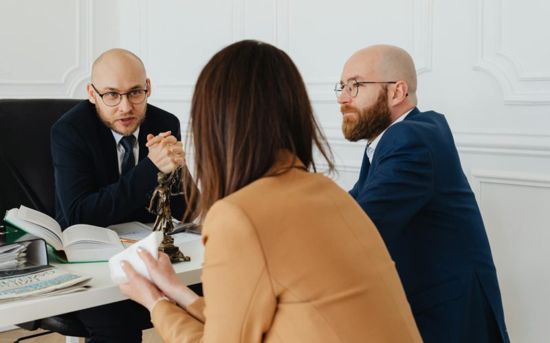 A Lawyer Talking to the Woman Wearing Brown Blazer