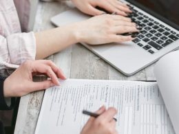 A Person Typing on Laptop