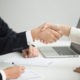 Hr handshaking successful candidate getting hired at new job
