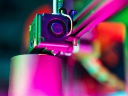 Vibrant 3D Printing Close-Up in Neon Lighting