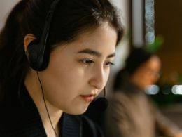 A Close-Up Shot of a Woman Wearing a Headset