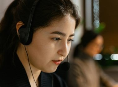 A Close-Up Shot of a Woman Wearing a Headset