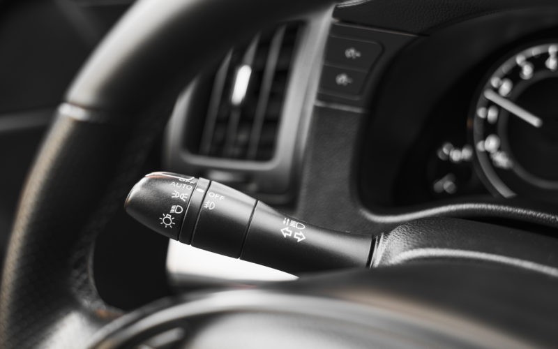 Auto steering wheel and light switch control paddle