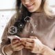 Smiling woman texting on her phone