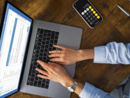 Top view woman typing on laptop