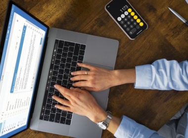 Top view woman typing on laptop