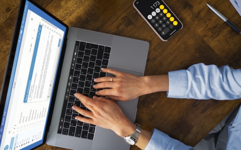 Top view woman typing on laptop