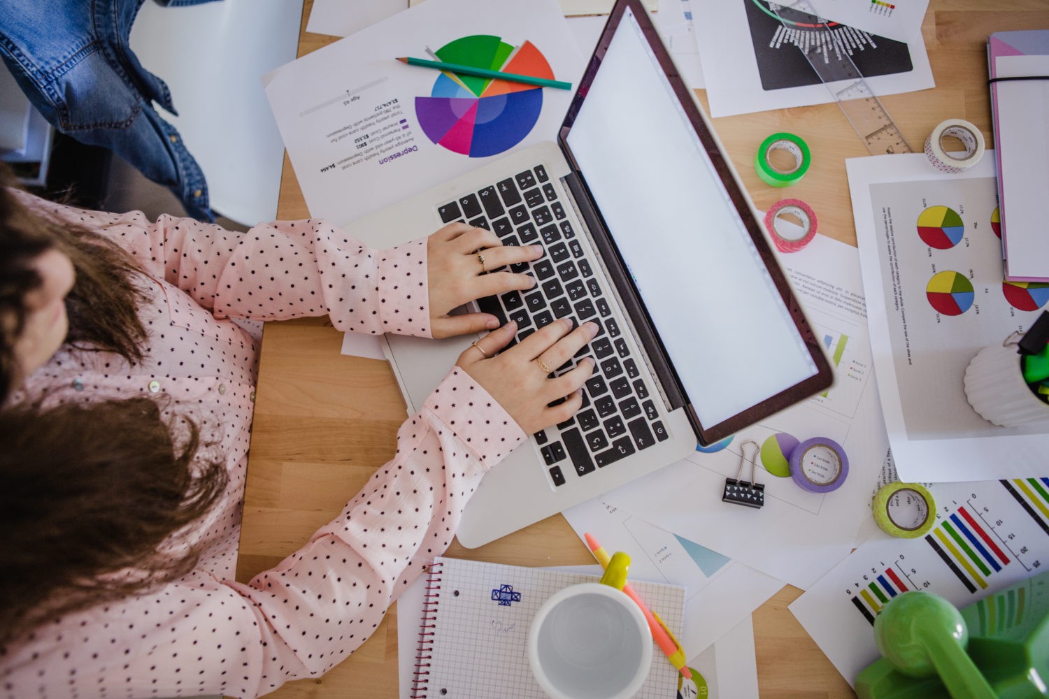 woman typing laptop in office