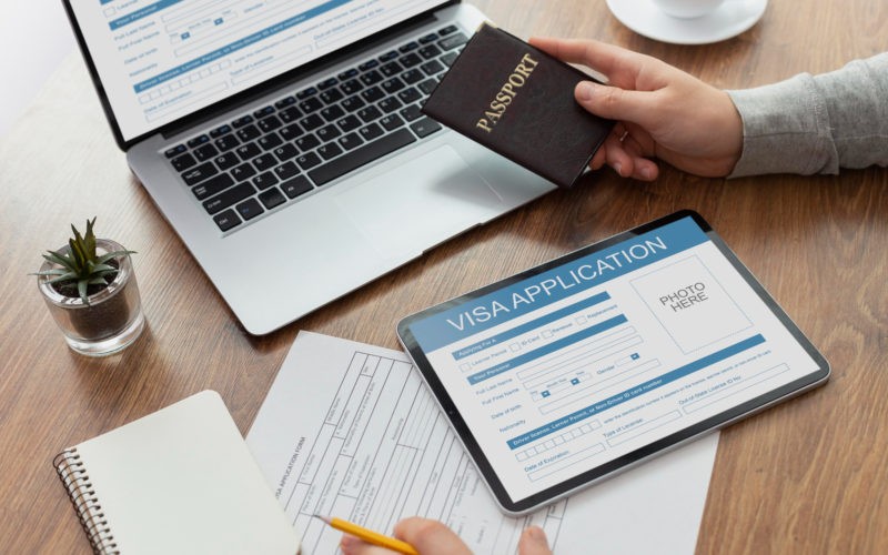 Visa application form on laptop and tablet