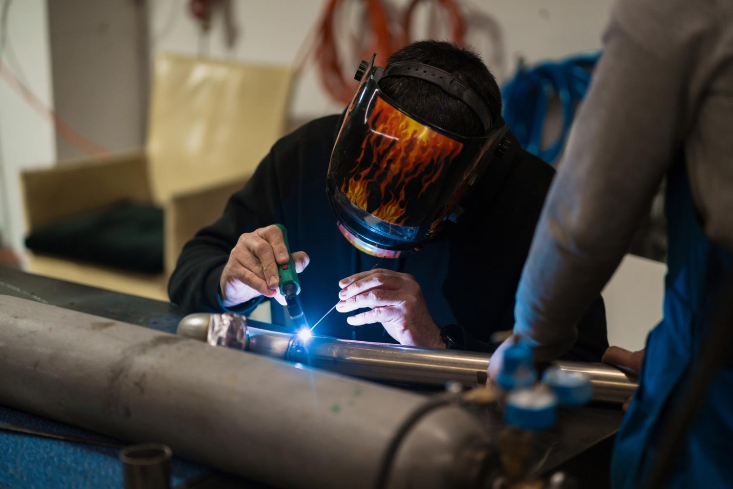 Man working with a welding machine