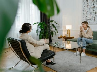 A Sad Woman Sitting on a Sofa
