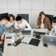 A Group of People Discussing in an Office