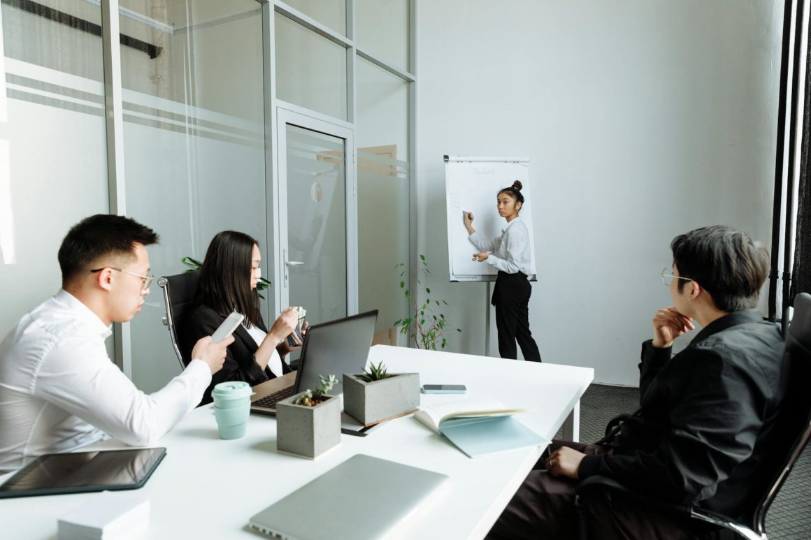 A Group of People Having a Meeting in the Office