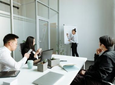 A Group of People Having a Meeting in the Office