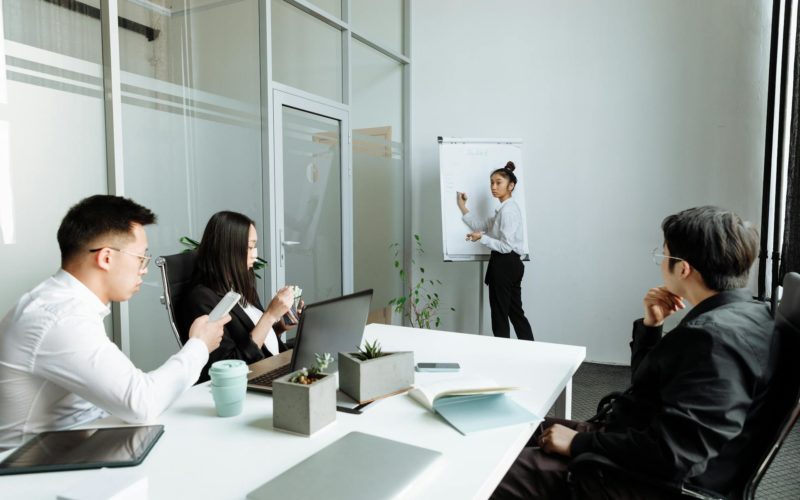 A Group of People Having a Meeting in the Office