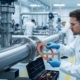 A technician performing proactive gasket replacement in an industrial setting, ensuring system integrity and preventing future failures