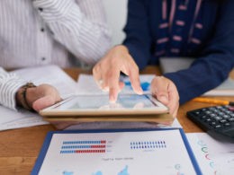 Coworkers discussing documents