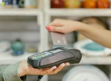 A Person Holding a Payment Terminal