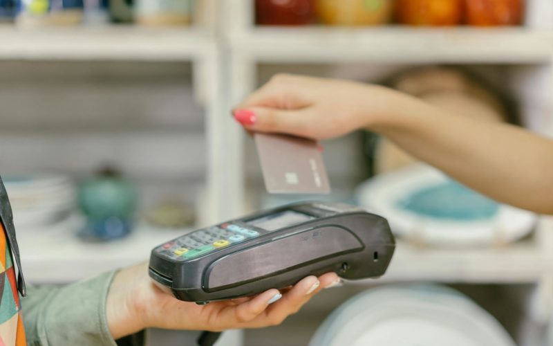 A Person Holding a Payment Terminal