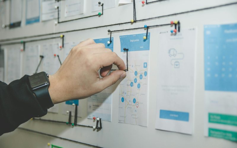 A person engaged in project management / UI/UX design planning