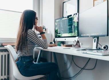 girl using desktop computer in room