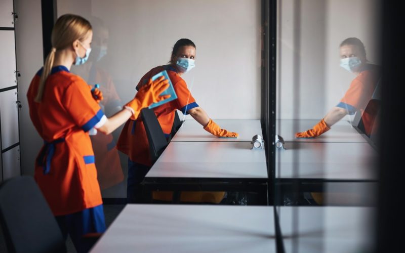 Two Workers Rubber Gloves Cleaning Surfaces