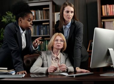 Female Lawyers in an Office Looking at a Computer