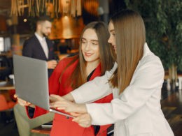 Two businesswomen working in a cafe