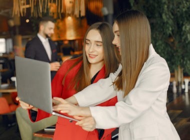 Two businesswomen working in a cafe