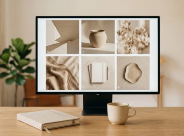 A designer's workspace with a monitor showing a cohesive grid of AI-generated brand assets (by Gemini Pro)